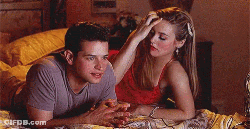 Man And Woman Laying On Bed Woman Touching Man's Head GIF