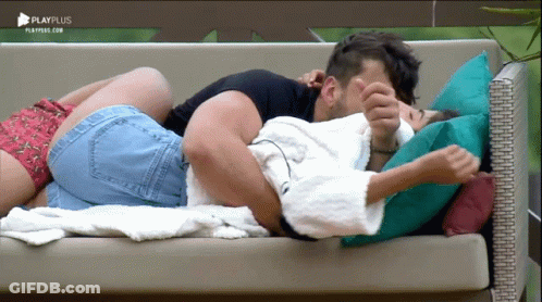 Man And Woman Laying On Couch With Playplus GIF