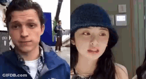 Man And Woman Looking At Camera Woman In Blue Hat GIF