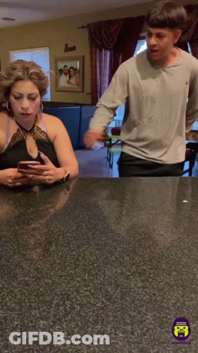Man And Woman Looking At Cell Phone GIF