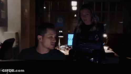 Man And Woman Looking At Computer With @Regifs GIF