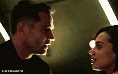 Man And Woman Looking At Each Other GIF
