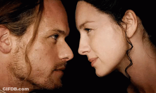 Man And Woman Looking At Each Other GIF
