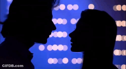 Man And Woman Looking At Each Other GIF