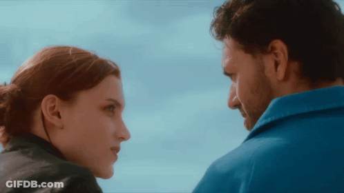 Man And Woman Looking At Each Other Blue Sky GIF