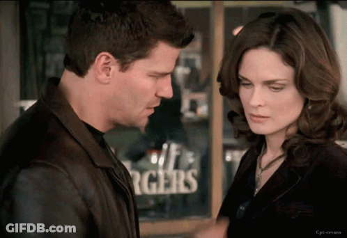 Man And Woman Looking At Each Other By Burgers Sign GIF
