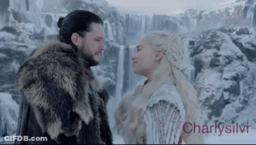 Man And Woman Looking At Each Other By Waterfall GIF