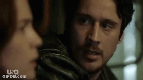 Man And Woman Looking At Each Other Close Up GIF