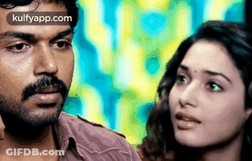 Man And Woman Looking At Each Other Colorful Background GIF