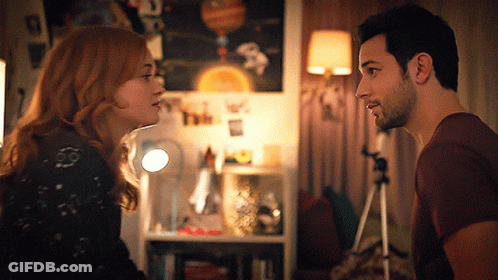 Man And Woman Looking At Each Other GIF