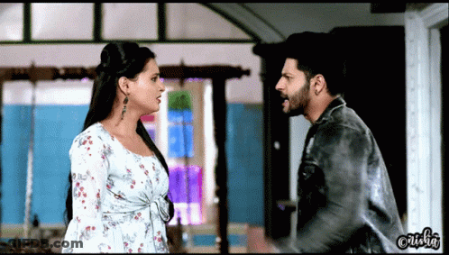 Man And Woman Looking At Each Other GIF