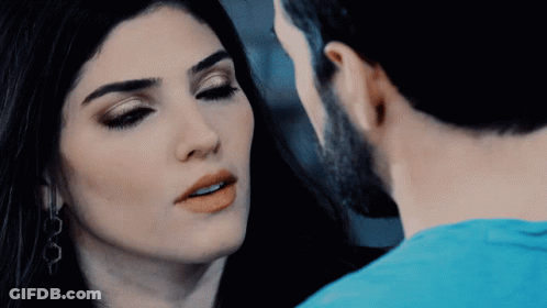 Man And Woman Looking At Each Other Eyes Closed GIF