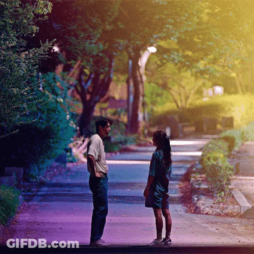Man And Woman Looking At Each Other GIF