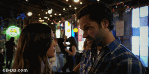 Man And Woman Looking At Each Other In Bar With 30 GIF
