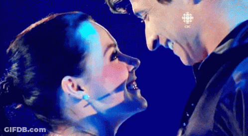 Man And Woman Looking At Each Other In Blue Light GIF