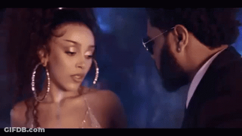 Man And Woman Looking At Each Other In Dark Room GIF
