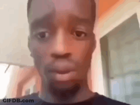 Man And Woman Looking At Each Other In Dark Room GIF