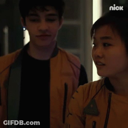 Man And Woman Looking At Each Other In Dark Room GIF