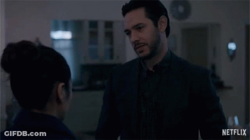 Man And Woman Looking At Each Other In Dark Room Netflix Trailer GIF