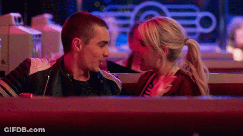 Man And Woman Looking At Each Other In Diner At Night GIF