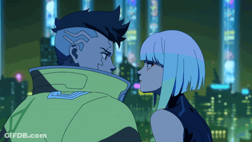 Man And Woman Looking At Each Other In Front Of City At Night GIF