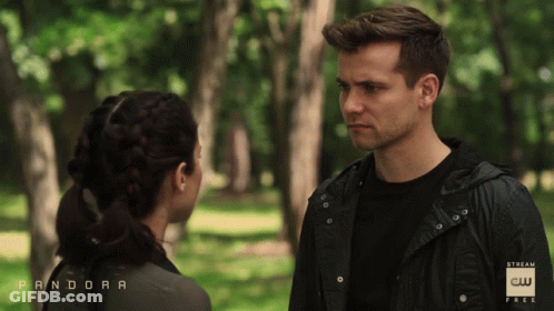 Man And Woman Looking At Each Other In Park Saying Pandora GIF