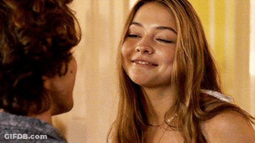 Man And Woman Looking At Each Other In Room GIF