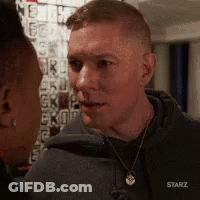 Man And Woman Looking At Each Other In Starz Hoodie GIF