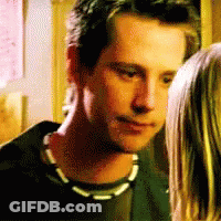 Man And Woman Looking At Each Other, Man With Necklace GIF