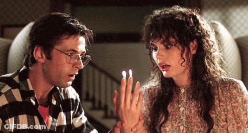 Man And Woman Looking At Each Other's Fingernails GIF