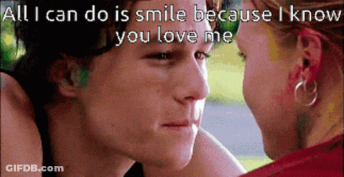 Man And Woman Looking At Each Other Saying All I Can Do Is Smile GIF