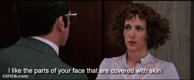 Man And Woman Looking At Each Other Saying I Like The Parts Of Your Face That Are Covered With Skin GIF