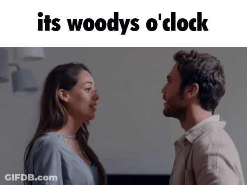 Man And Woman Looking At Each Other Saying It's Woody's O Clock GIF