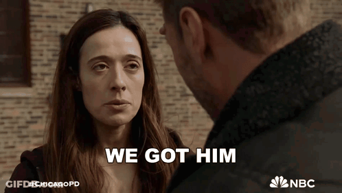 Man And Woman Looking At Each Other Saying We Got Him GIF