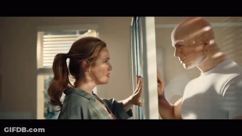Man And Woman Looking At Each Other Through Window GIF