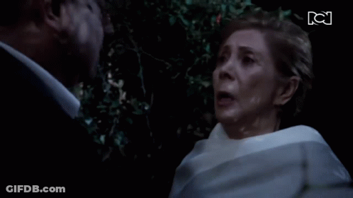 Man And Woman Looking At Each Other With KC GIF