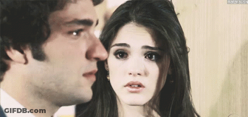 Man And Woman Looking At Each Other With Matarazzo Watermark GIF