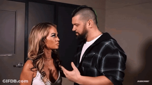 Man And Woman Looking At Each Other With Subscribe GIF