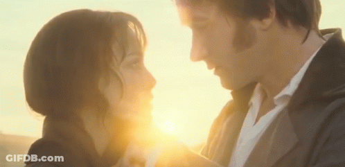 Man And Woman Looking At Each Other With Sun Shining Through Eyes GIF