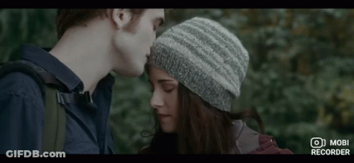 Man And Woman Looking At Each Other Woman In Knitted Hat GIF