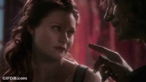 Man And Woman Looking At Each Other Woman Pointing At Face GIF