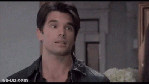 Man And Woman Looking At Each Other Woman With Hoop Earrings GIF