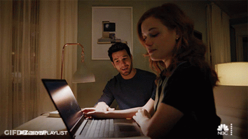 Man And Woman Looking At Laptop With #Zoeysplaylist GIF