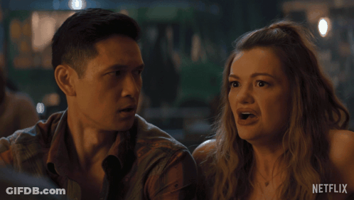 Man And Woman Looking At Netflix Logo GIF