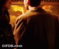 Man And Woman Looking At Painting GIF