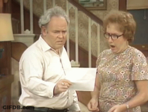 Man And Woman Looking At Paper GIF