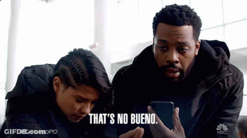 Man And Woman Looking At Phone Saying No Bueno GIF