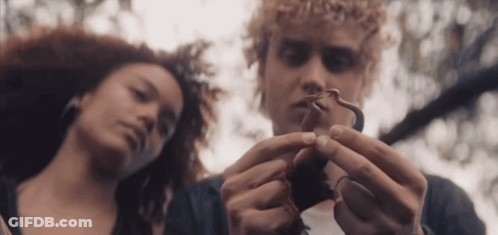 Man And Woman Looking At Snake GIF