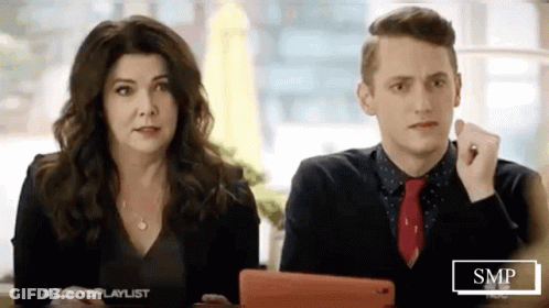 Man And Woman Looking At Tablet GIF