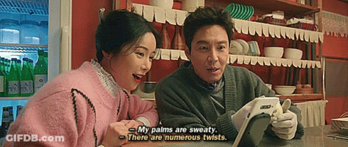 Man And Woman Looking At Tablet GIF